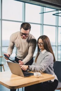 Working day in a modern office with workers in casual clothes, male and female colleagues